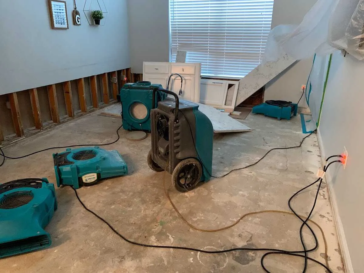 Dehumidifier in flood-cut room for Water Damage Restoration in White Lake